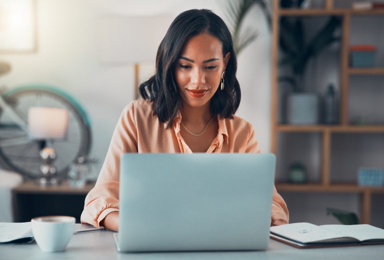 Seller managing an online business from a home office laptop